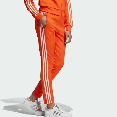 grey and orange adidas pants